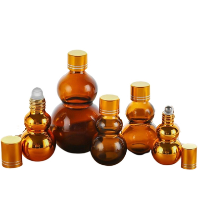 사용자 정의 가능한 프리미엄 10ml / 50ml / 100ml Amber Glass 향수 오일 롤 컵에 골든 미러 마무리 듀얼 골든 캡 & 두꺼운 베이스